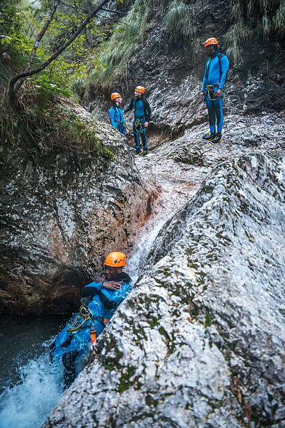 istock Black Male Sliding Down Canyoning Adventure 2248535806