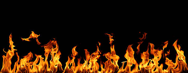 istock Realistic isolated fire flames on black background, perfect for digital design, photo compositing, visual effects, and creative projects requiring high-detail fiery textures and dynamic heat energy. 2248537576