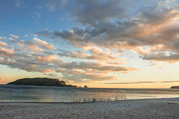 Beach in Budva overlooking the island of St Nicholas. Sunset on the Adriatic Sea.