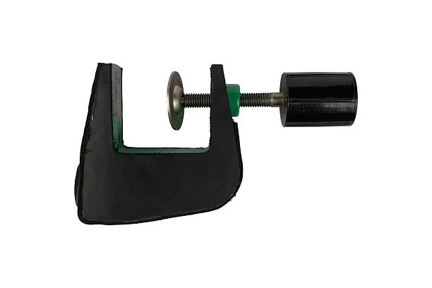 Rubber-padded table edge screw clamp with disc pad and knurled knob is isolated.