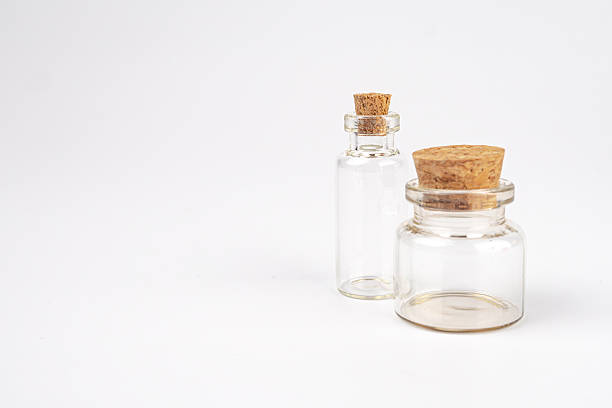 istock Empty test tube, potionsalchemy, two glass bottles, table, cork stoppers, yellowish, less transparent liquid, soft lighting, subtle shadows, gentle ambiance, realistic style, fadedvintage look, ang. m 2248539301