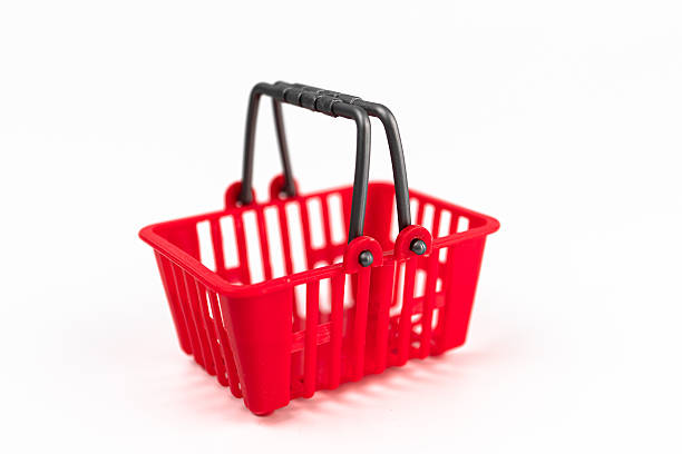 istock Isolated red shopping cart over white background, minimalist style, empty, light gray surface, high contrast, artificial lighting. m 2248539606