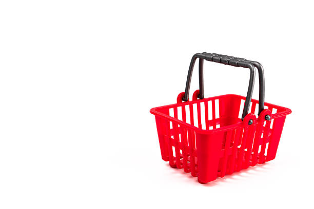 istock Red mini shopping cart on a white background, emphasizing its structure and mobility. m 2248540284