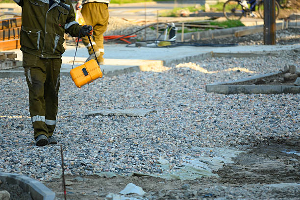 istock Worker Inspecting Construction Site Near Road in Summer 2248540416