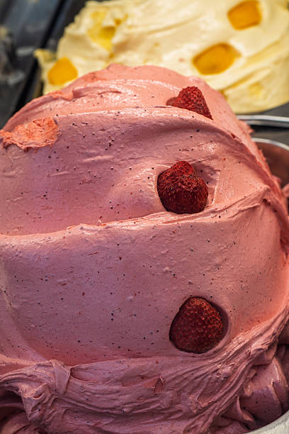 istock Strawberry gelato with fruit pieces in display 2248540993