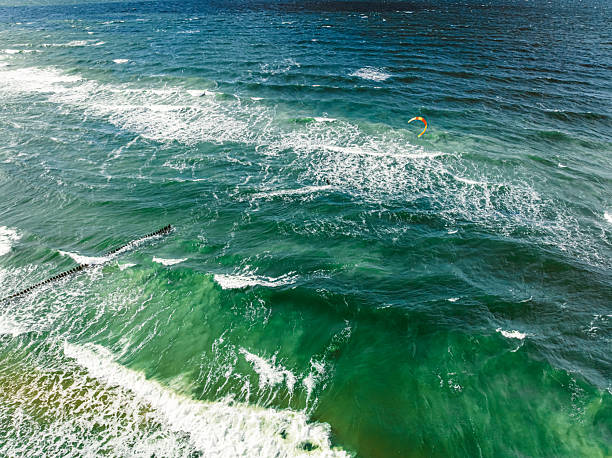 istock Outstanding kitesurfer on big waves at Baltic Sea. 2248541016