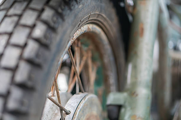 istock Close-up image of a vintage off-road bicycle wheel, showcasing its structure and texture under even lighting. m 2248541906