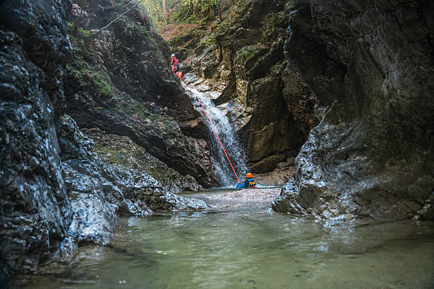istock Diverse People Sliding with Rappel Ropes at Canyoning 2248542370