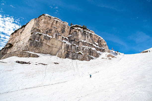 Snowy off-piste slope for freeride with traces from skis, snowboards