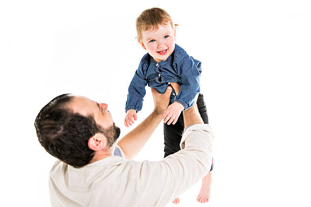 istock Dad and daughter in the studio on a white background 2248545115