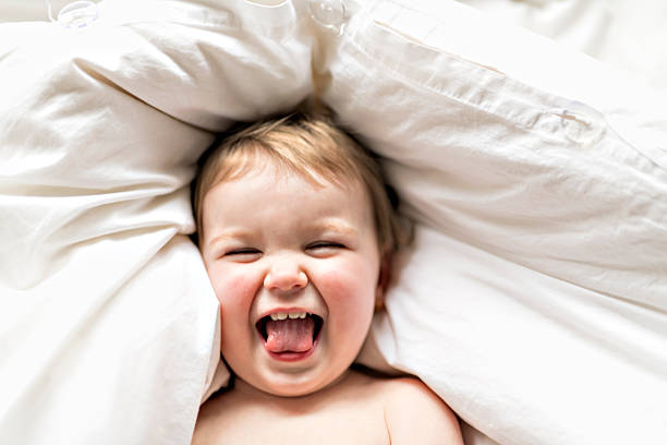 istock one years girl baby on the bed 2248545209