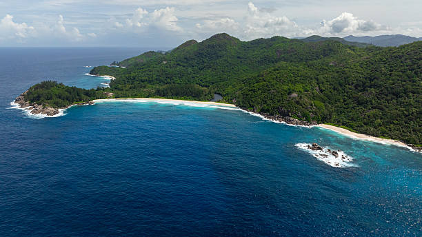 istock Pristine coastline with rainforest and rocky outcrops in Seychelles, Mahe. 2248547589