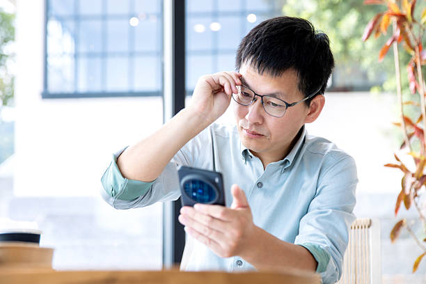 istock An Asian businessman using his mobile phone in a coffee shop 2248547648