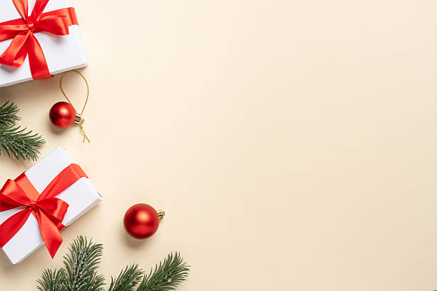 istock Christmas present, balls and fir tree branches. 2248550481