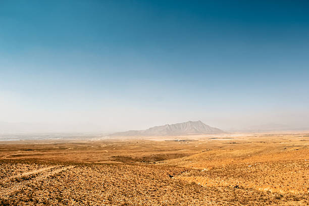 Desert with mountains. Panorama of a desert in Afghanistan with mountains in the background