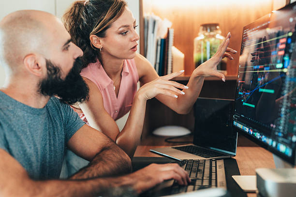 istock Financial analysts discussing cryptocurrency market trends 2248554214