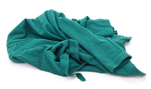 istock Green fabric cloth crumpled on white background. 2248555316