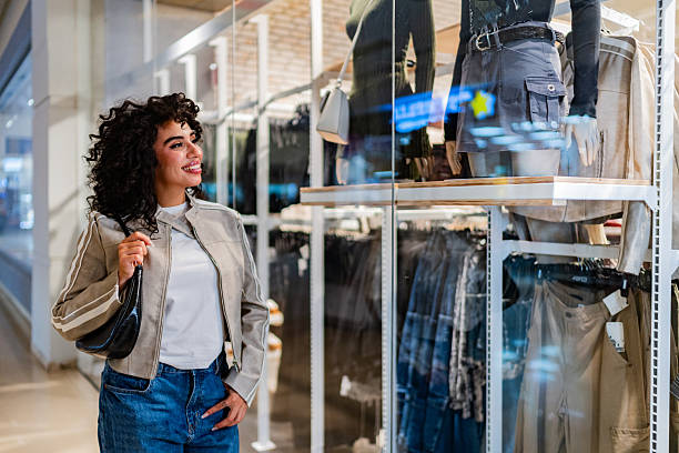 istock Young woman walking through the mall 2248556141