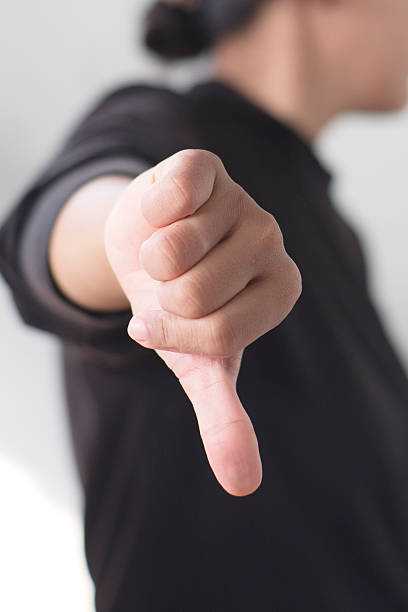 istock Close Up of Hand Making Disapproval Gesture 2248556386