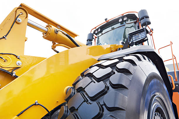 istock Tractor with hydraulic cylinder of loader bucket 2248557209