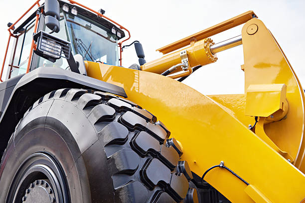 istock Tractor with hydraulic cylinder of loader bucket 2248557230