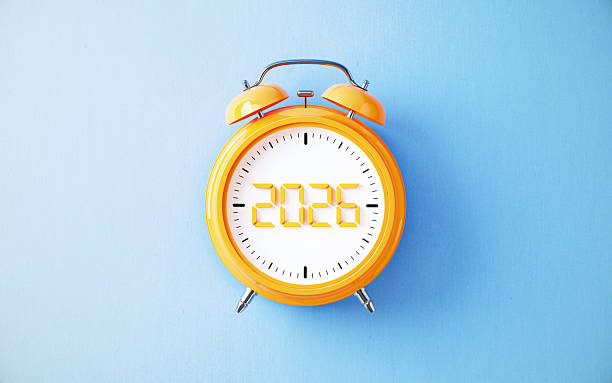 Yellow Alarm Clock with 2026 written inside on blue background