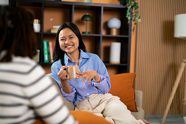 istock Friends enjoying casual conversation and coffee at home 2248559629
