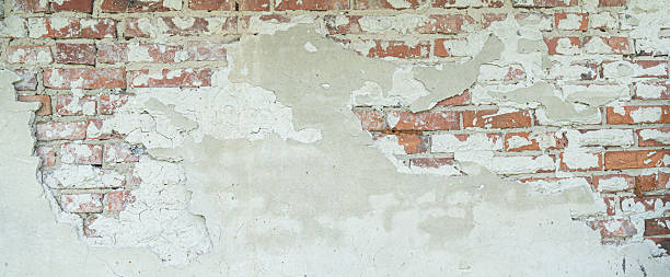 istock old brick wall, red and white colour, broken bricks, peeling plaster, vintage texture, background for banner, copy space 2248559790