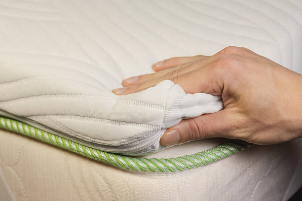 istock Hand is touching very soft orthopedic topper mattress. 2248560950