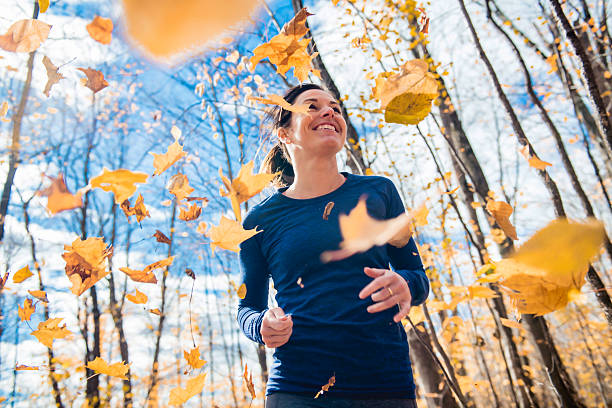 istock A Bautiful running woman jogging in autumn nature 2248561027