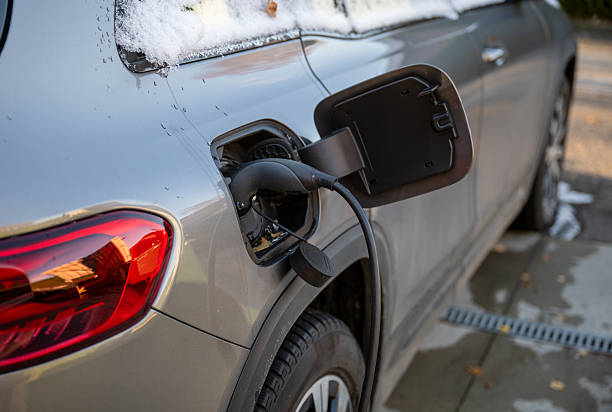 istock electric car charging in winter driveway 2248562042