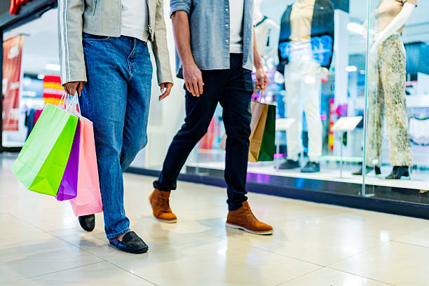 istock Low section of couple walking with shopping bag atmall 2248564805
