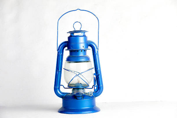 Antique blue oil lamp hanging on the wall