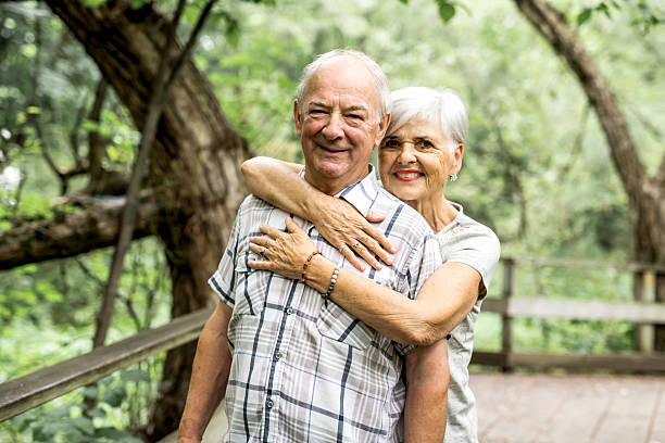 istock Happy old elderly caucasian couple in a park 2248566048