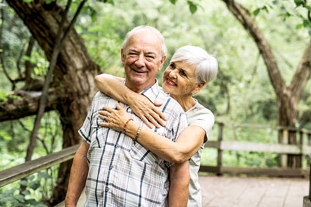 istock Happy old elderly caucasian couple in a park 2248566053
