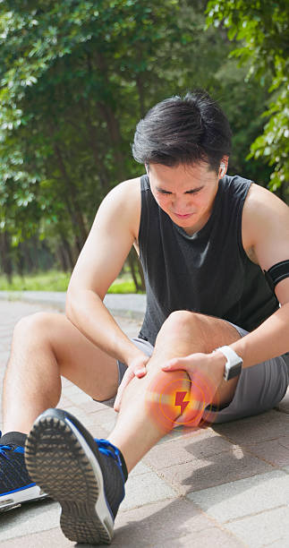 istock asian man sporting calf cramping 2248566492