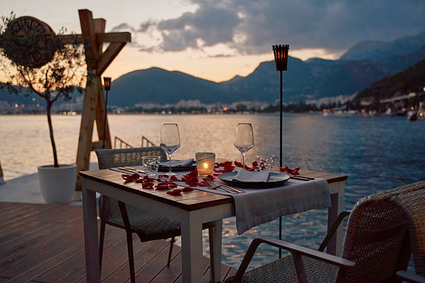 istock Romantic Waterfront Dining Experience with Scenic Views and Candlelit Ambiance at Dusk 2248567242