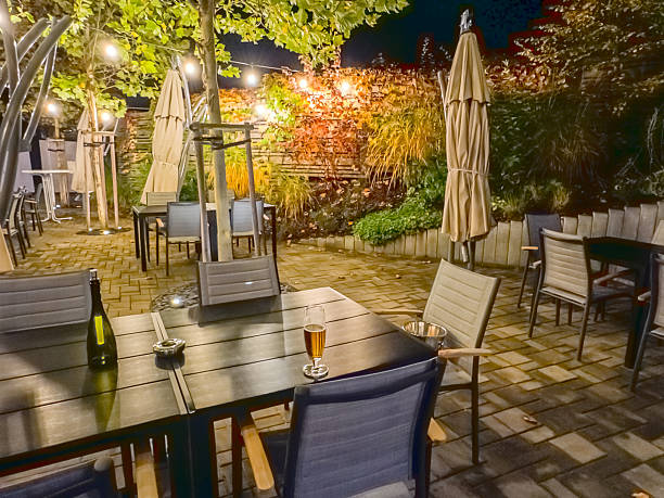 istock Outdoor cafe garden with tables and night lighting 2248568564