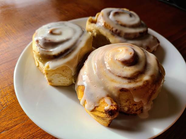 istock Fresh Cinnamon Rolls with Melting Frosting, Eye-Level View 2248571519