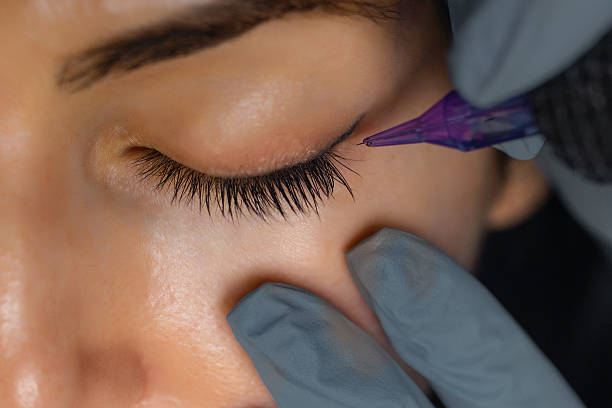 istock Close up of a cosmetologist performing eyelid 2248571786