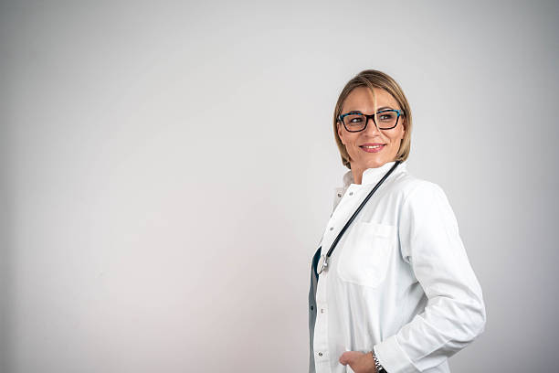 istock Happy smiling female doctor in white coat. 2248571861