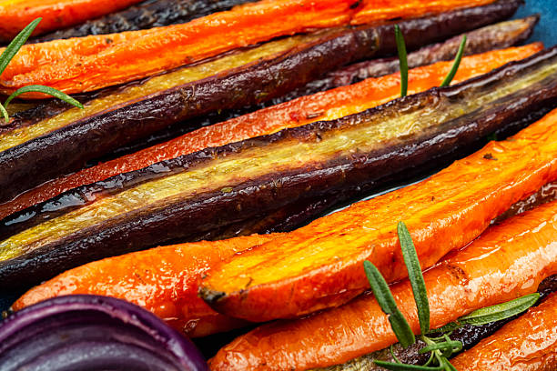istock Colorful roasted rainbow carrots. 2248573600