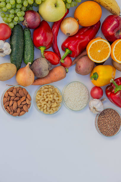 istock Set of basic healthy eating ingredients: vegetables, grains, and nuts with copy space 2248575025