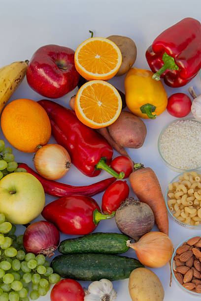 istock Set of basic healthy eating ingredients: vegetables, grains, and nuts with copy space 2248575035