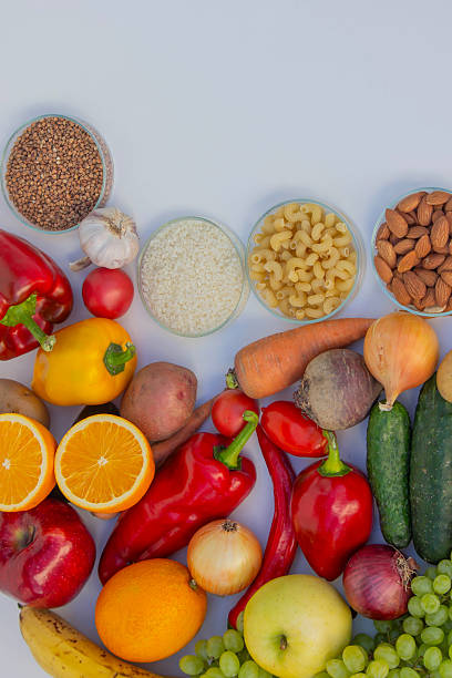 istock Set of basic healthy eating ingredients: vegetables, grains, and nuts with copy space 2248575041