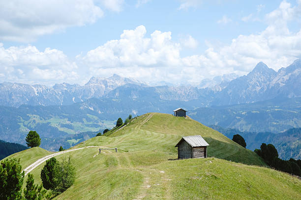 Alpine meadow and mountain hut in summer, Dolomites