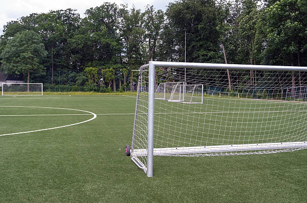 istock View of an artificial turf soccer field during a training session with many goals set up on the pitch / the training area 2248579556
