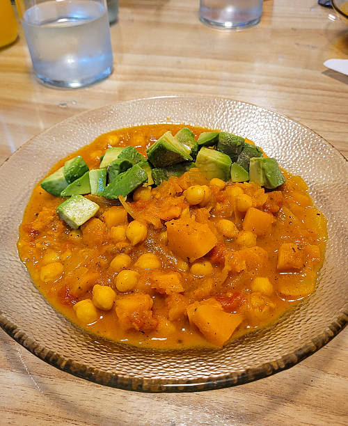 Homemade Chickpea Stew with Pumpkin and Fresh Avocado