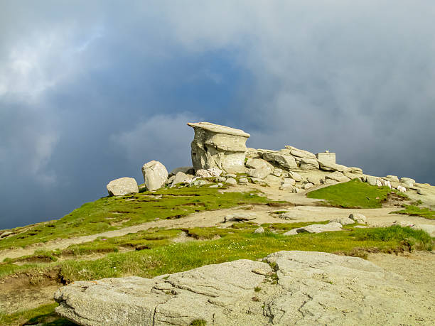 istock Bucegi Mountains in Romania with summer green slopes, rocky cliffs, high plateau, clear sky, scenic landscape 2248581483
