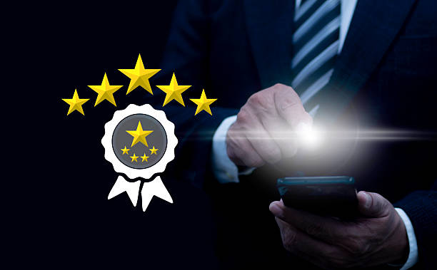 istock Businessman customer giving five star rating on smartphone, Customer service experience and feedback review satisfaction. 5 star rating. Review, Service rating, Satisfaction 2248581526